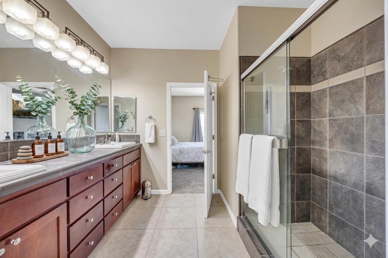 411 Sunrise Road Copperopolis, CA 95228 - Photo 40 of 76 Virtually Staged counter decor. View of the large, tiled shower.