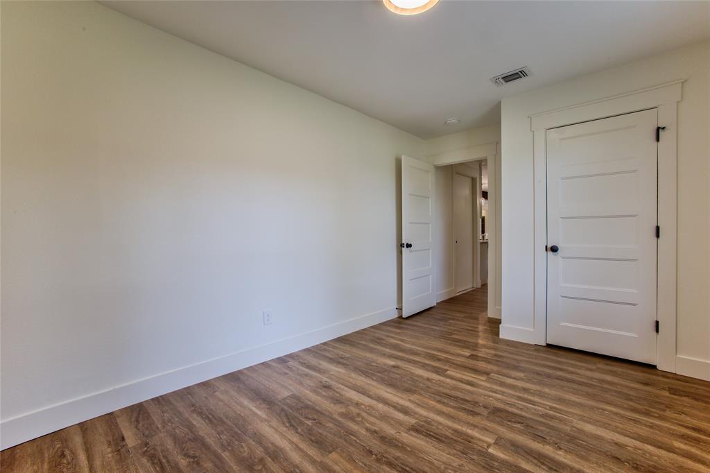 206 Americana Road Palmer, TX 75152 - Photo 28 of 40 View #2 Into #1 Bedroom Or Home Office wNew Recessed Light, LVP Flooring Thoughout.