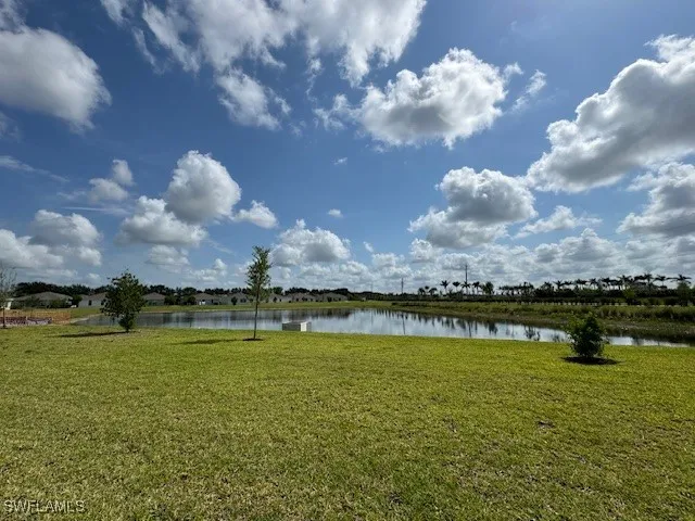 a view of a lake with a big yard