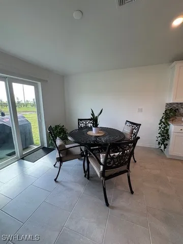 a view of a room with furniture and a window