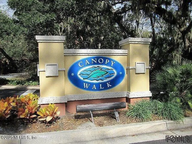 an aerial view of a house with garden space and sitting area