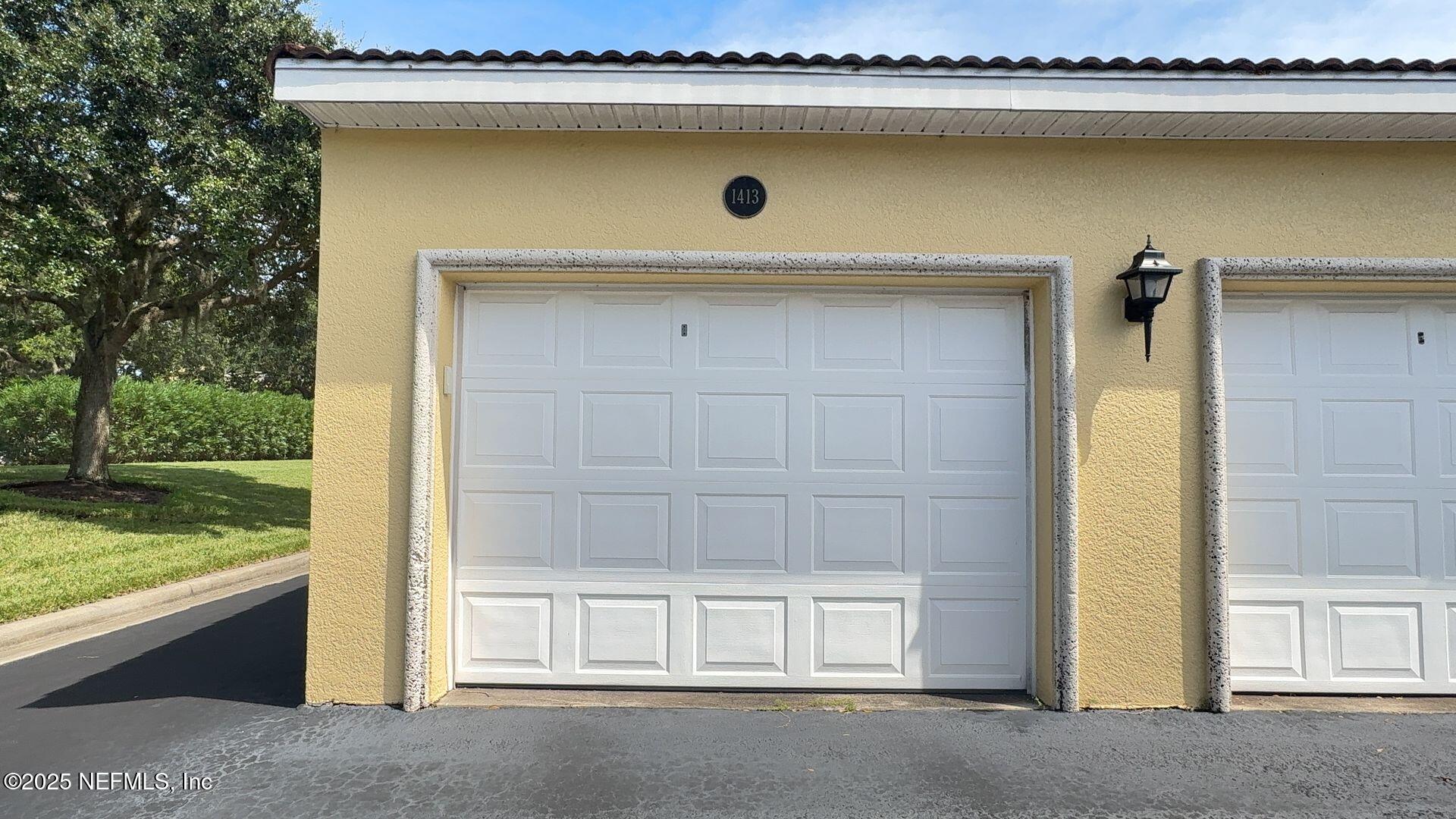 1400 Canopy Walk Lane, Unit 1413 Palm Coast, FL 32137 - Photo 3 of 17 Garage