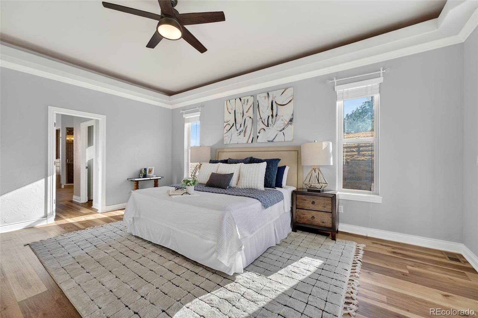 575 Howling Circle Elizabeth, CO 80107 - Photo 13 of 48 a bedroom with a large bed and a window