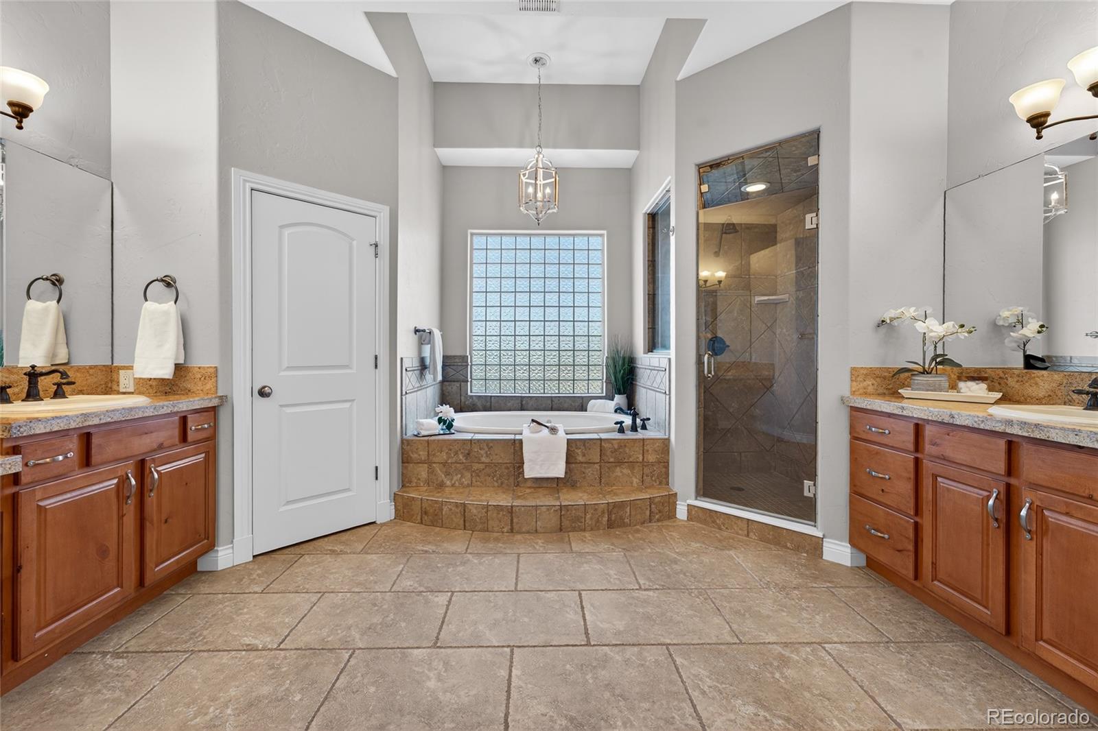 575 Howling Circle Elizabeth, CO 80107 - Photo 17 of 48 a bathroom with a sink a toilet and shower