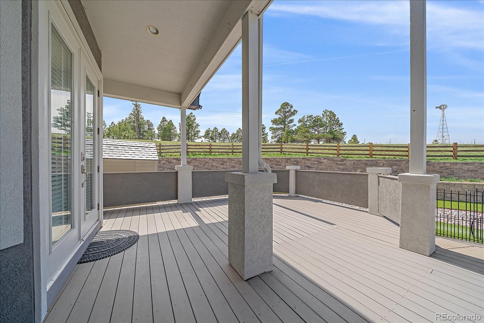 575 Howling Circle Elizabeth, CO 80107 - Photo 36 of 48 a view of a balcony with wooden floor