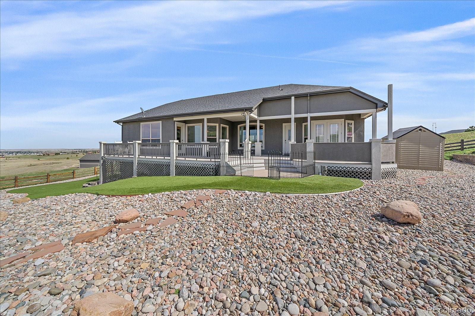 575 Howling Circle Elizabeth, CO 80107 - Photo 37 of 48 a view of house with a yard
