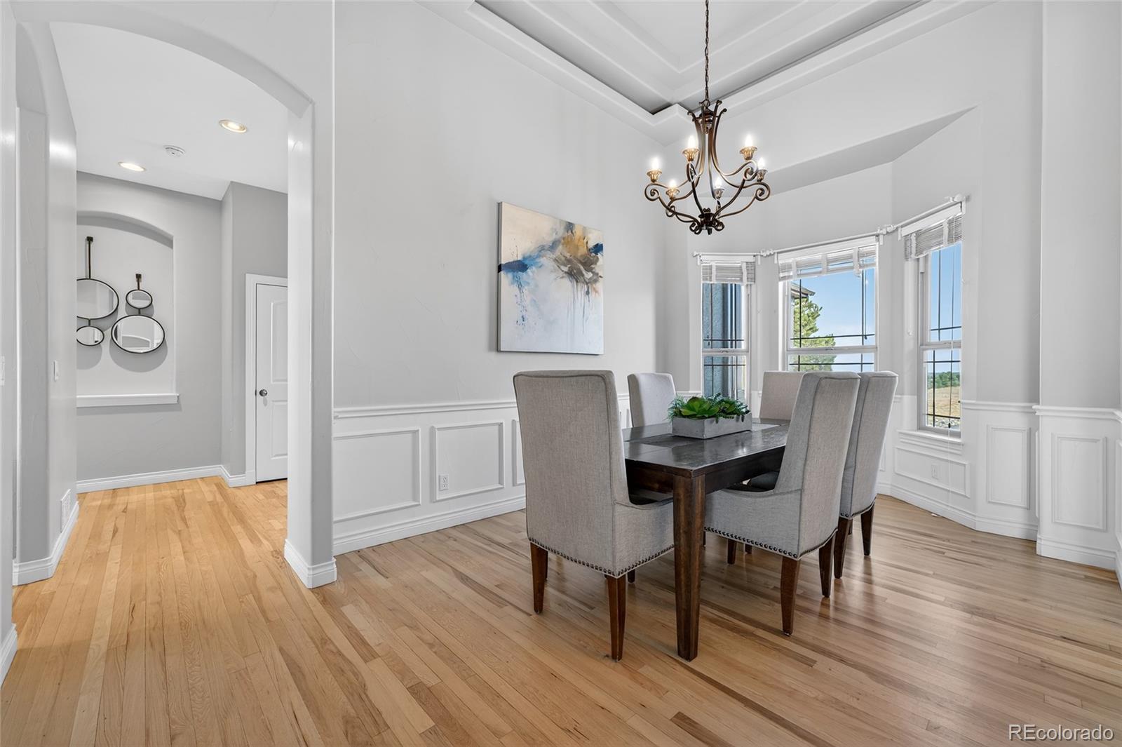575 Howling Circle Elizabeth, CO 80107 - Photo 9 of 48 a view of a dining room with furniture wooden floor and chandelier
