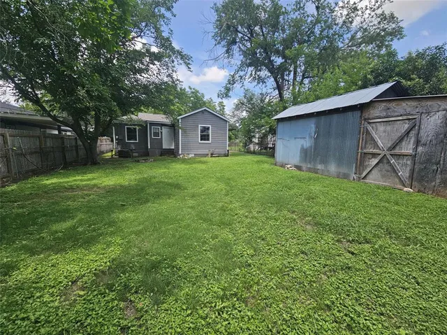 a fire hydrant in the middle of a big yard