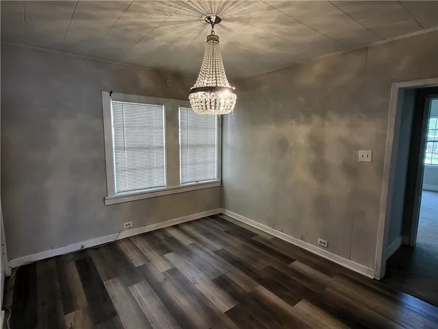 a room with a window and a wooden floor