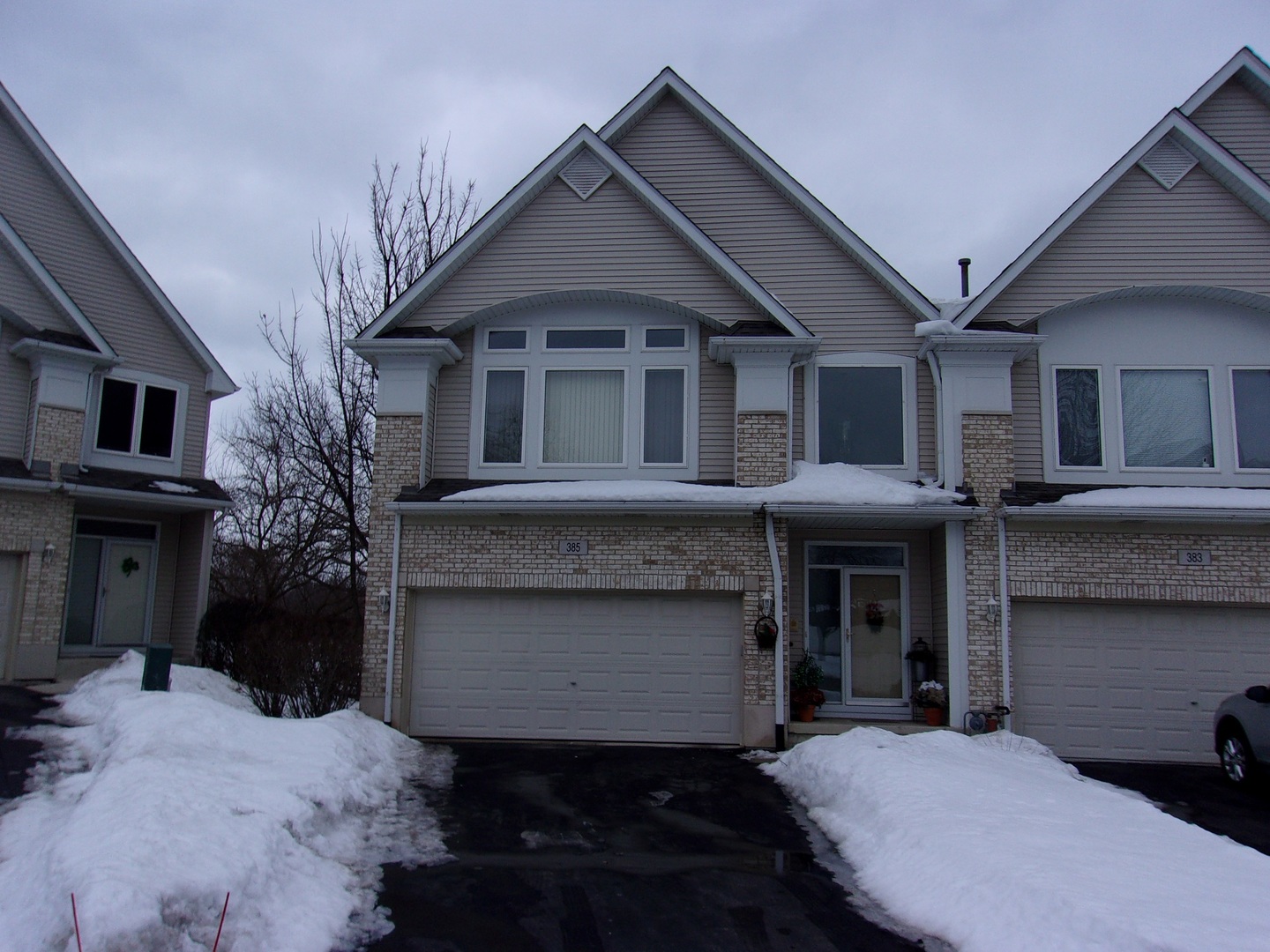 385 Aaron Lane Bolingbrook, IL 60440 - Photo 1 of 20 a front view of a house with a yard