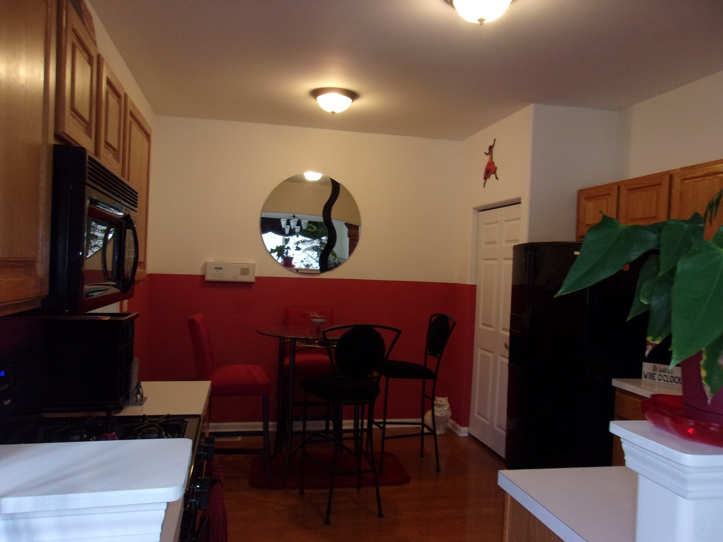 385 Aaron Lane Bolingbrook, IL 60440 - Photo 7 of 20 a view of a dining room with furniture and wooden floor