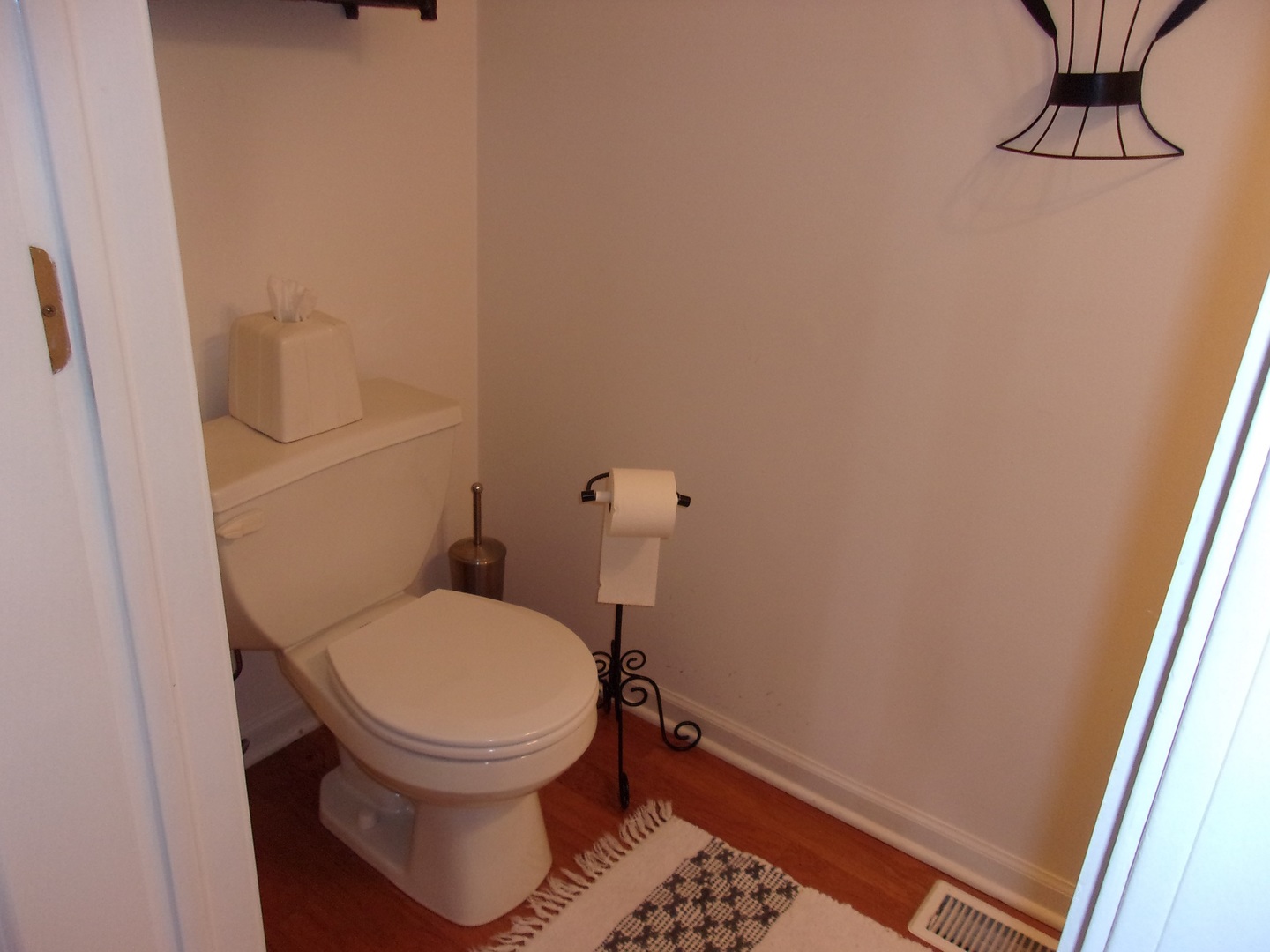 385 Aaron Lane Bolingbrook, IL 60440 - Photo 9 of 20 a white toilet sitting next to a small sink