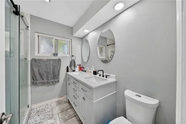 a view of a storage and utility room with dryer and washer
