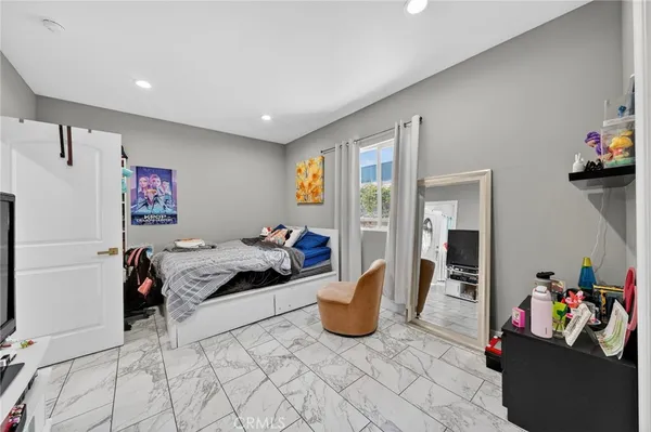 a bedroom with furniture and a couch