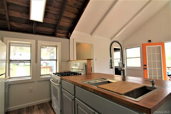 a view of a kitchen with a large window