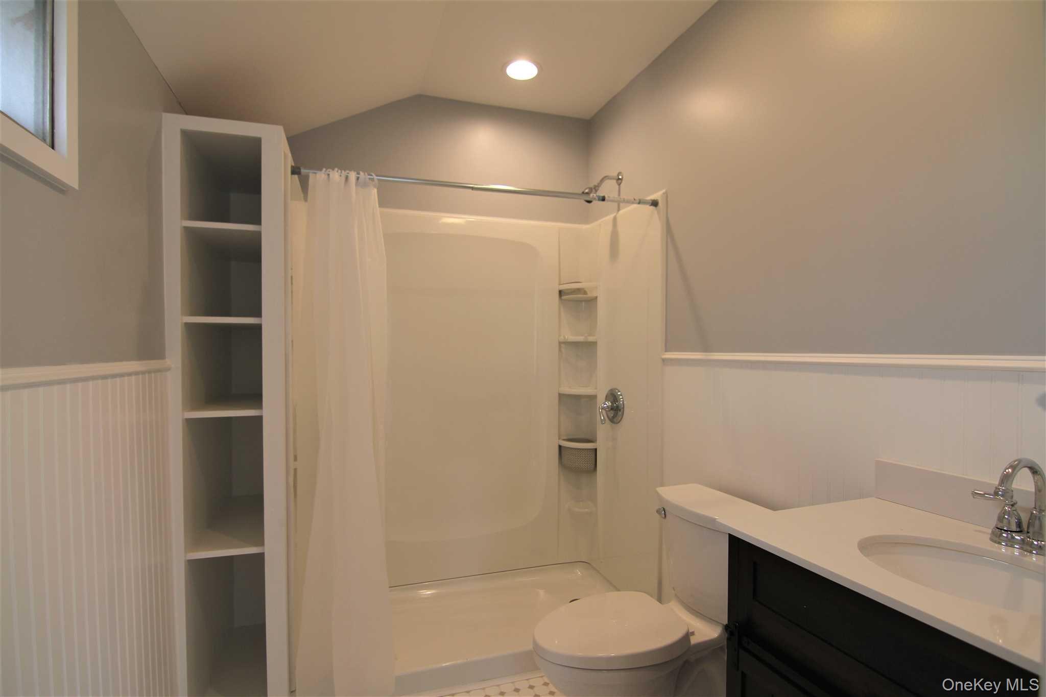 71 Miller Road, Unit 12 Hopewell Junction, NY 12533 - Photo 16 of 31 a bathroom with a sink toilet vanity and shower