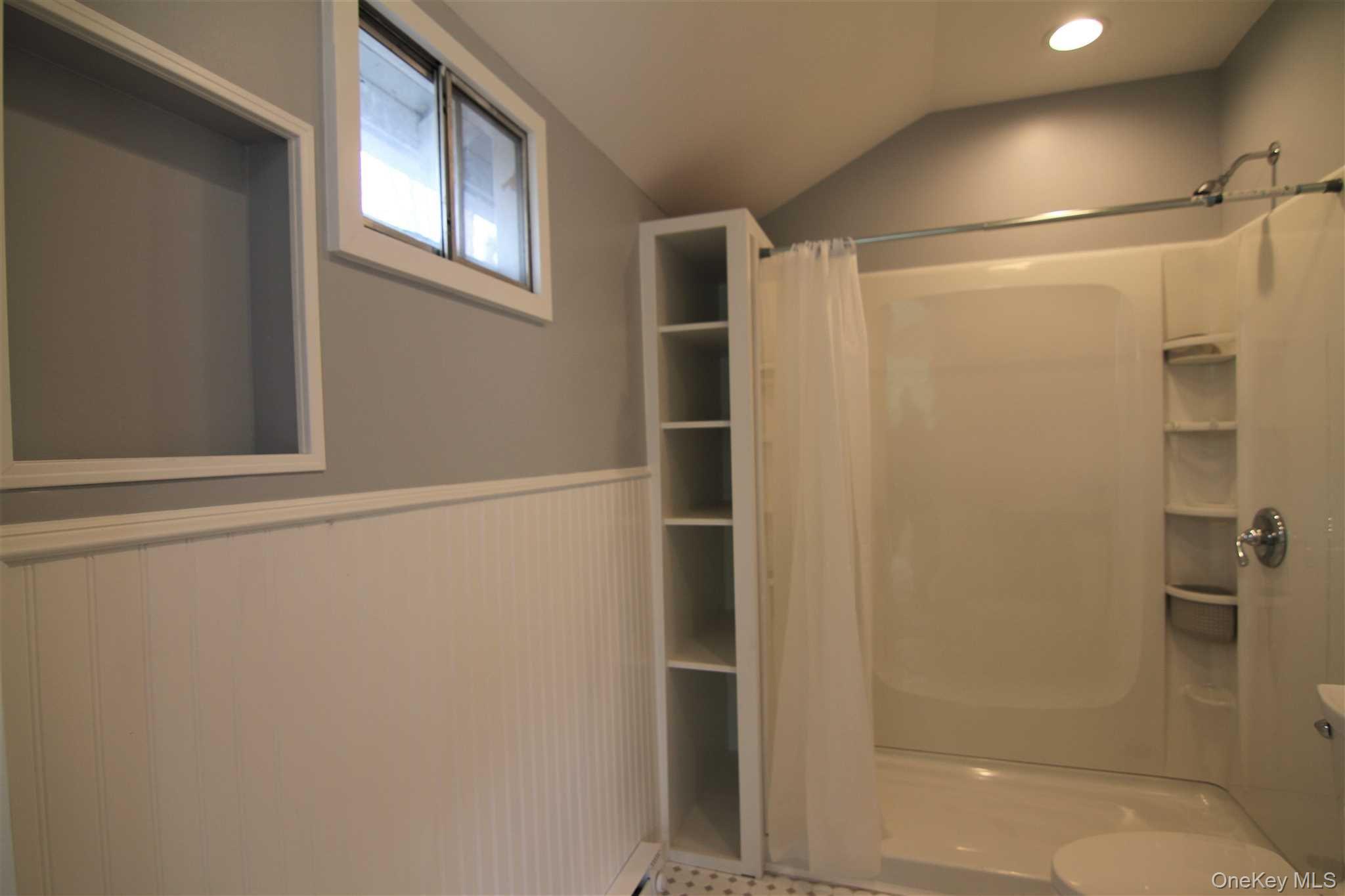 71 Miller Road, Unit 12 Hopewell Junction, NY 12533 - Photo 22 of 31 a bathroom with a glass shower door