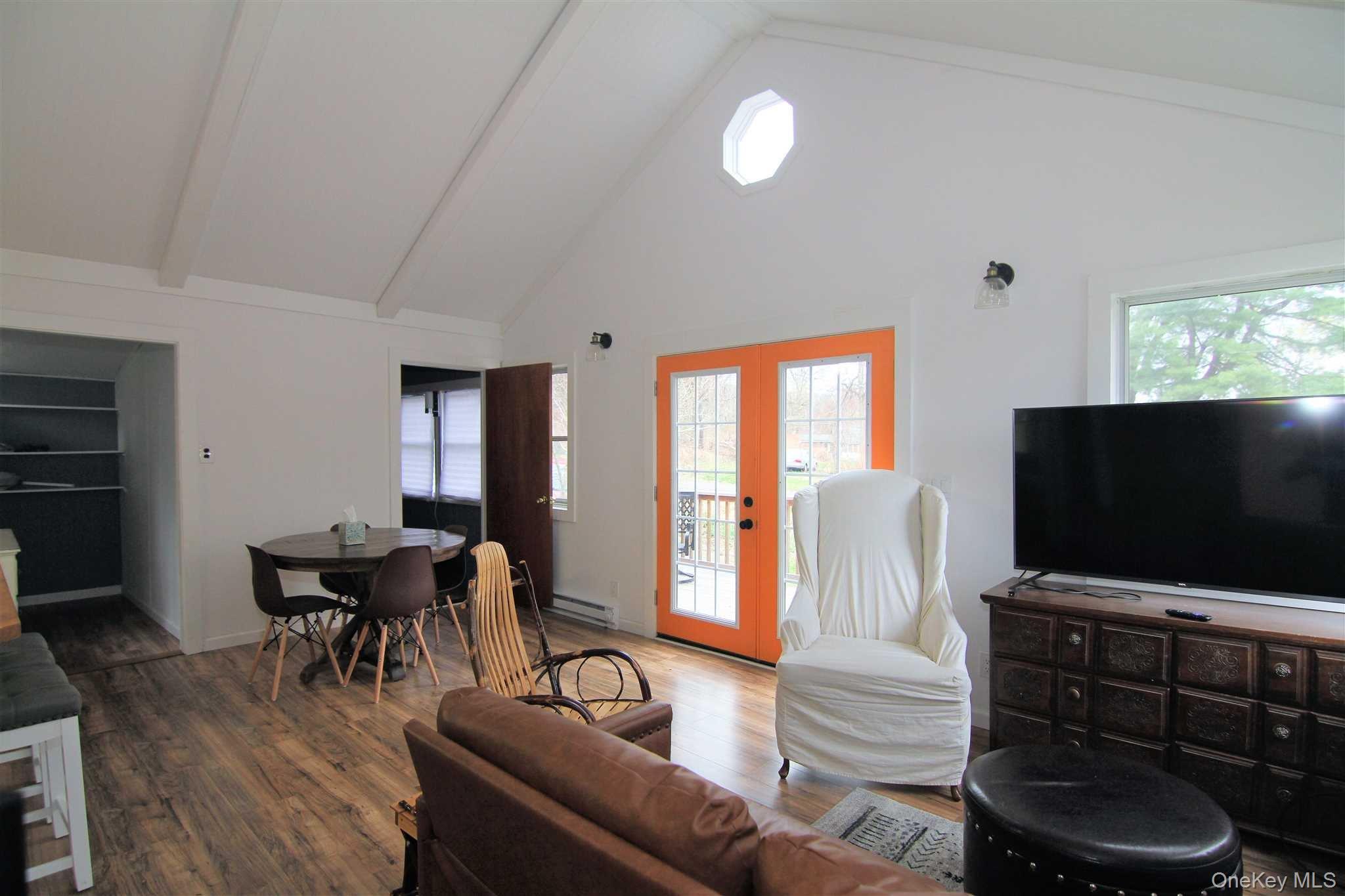 71 Miller Road, Unit 12 Hopewell Junction, NY 12533 - Photo 7 of 31 a living room with furniture and a flat screen tv