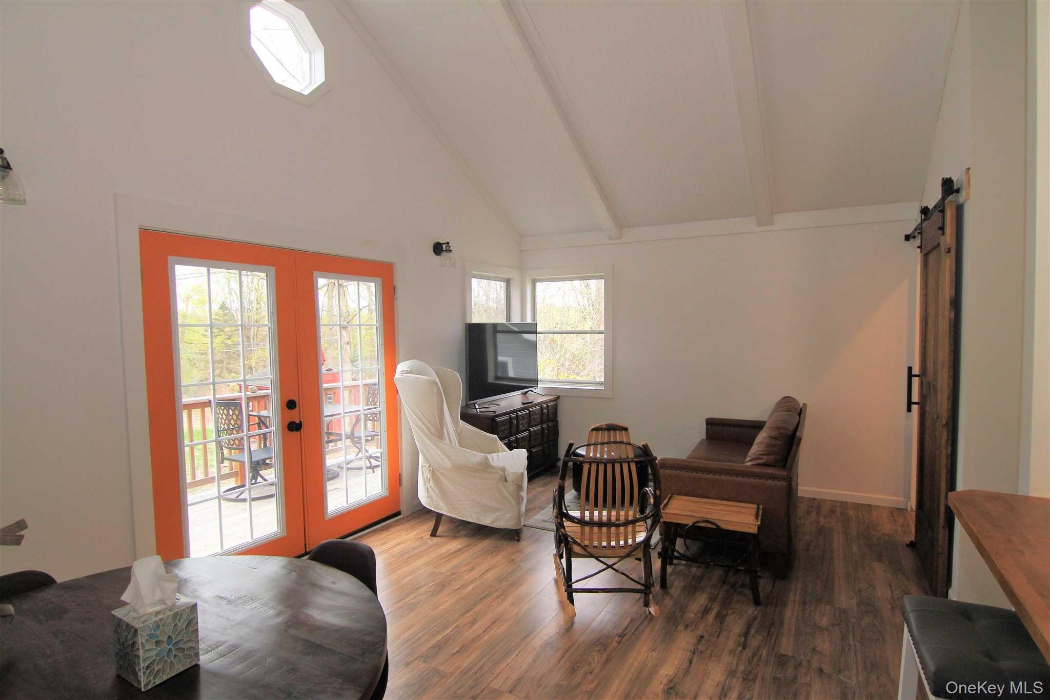 71 Miller Road, Unit 12 Hopewell Junction, NY 12533 - Photo 8 of 31 a living room with furniture and a wooden floor