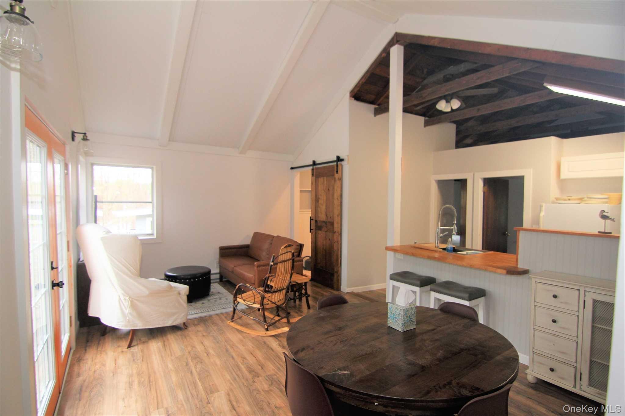 71 Miller Road, Unit 12 Hopewell Junction, NY 12533 - Photo 9 of 31 a living room with furniture and a wooden floor
