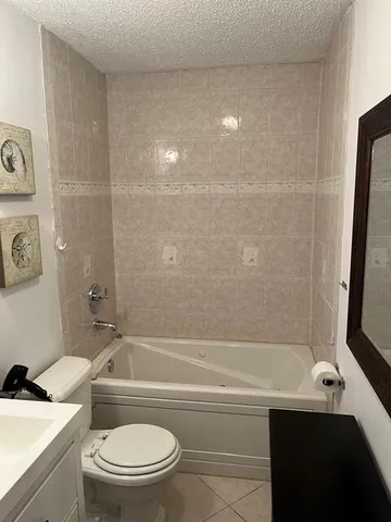 a bathroom with a sink a toilet and a bathtub