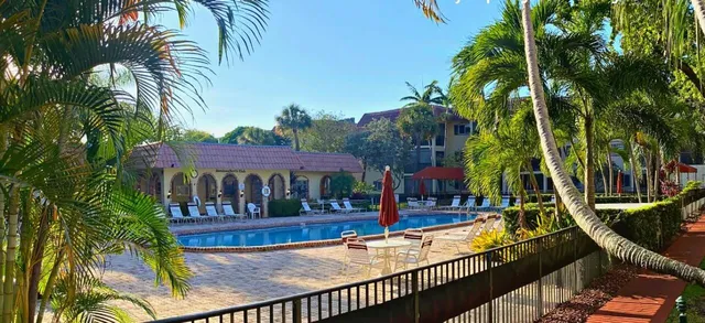 a view of a patio with swimming pool