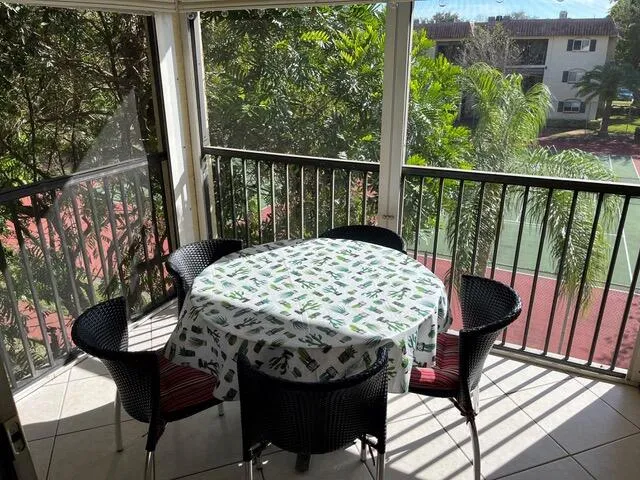 a view of a balcony with chairs