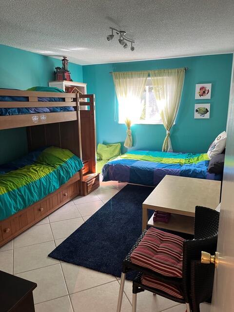 251 South Cypress Road, Unit 146 Pompano Beach, FL 33060 - Photo 10 of 20 a room with furniture and a flat screen tv