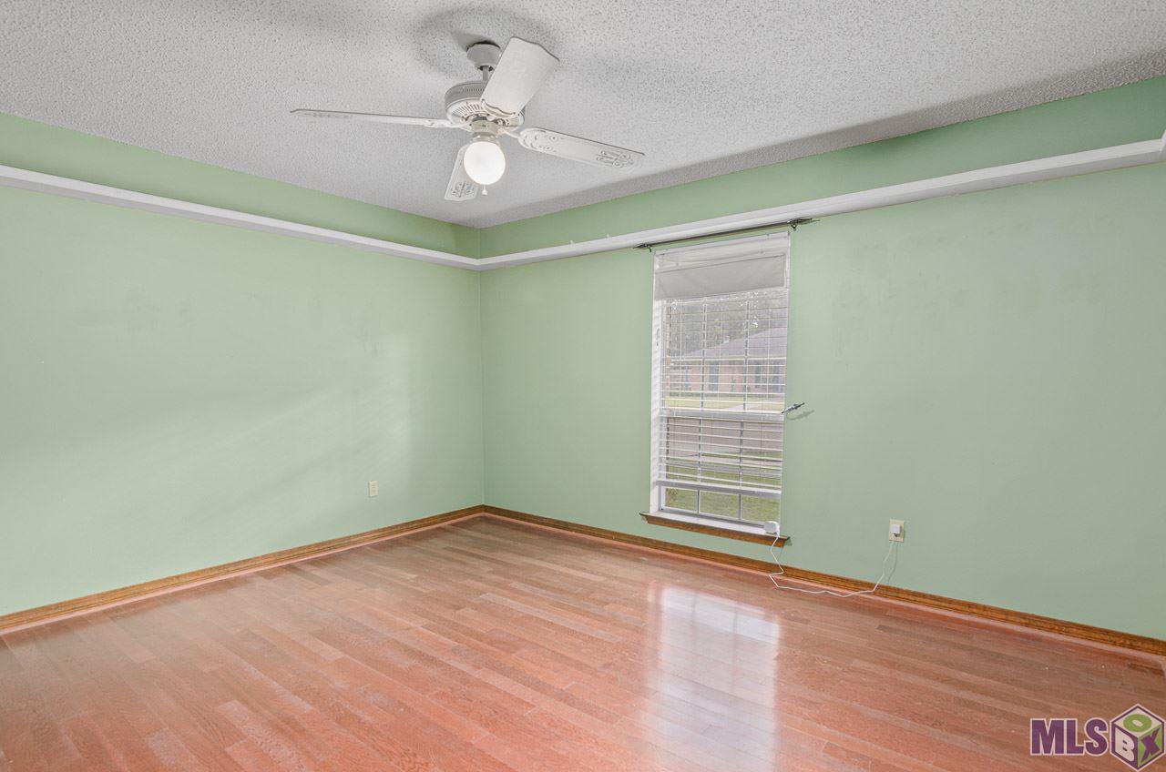 40234 La Rochelle Road Prairieville, LA 70769 - Photo 10 of 14 Large Bedroom with Bookshelf/ Display Shelf