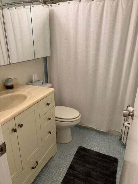 59 Tilford C, Unit 59 Deerfield Beach, FL 33442 - Photo 14 of 39 a bathroom with a granite countertop sink toilet and vanity