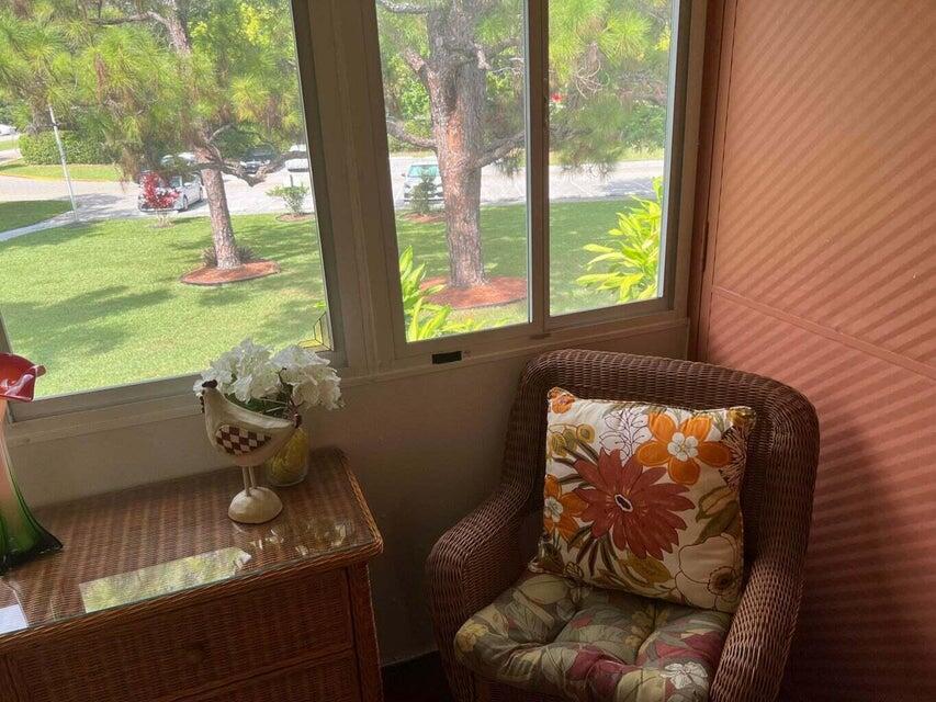 59 Tilford C, Unit 59 Deerfield Beach, FL 33442 - Photo 15 of 39 a room with furniture and garden view