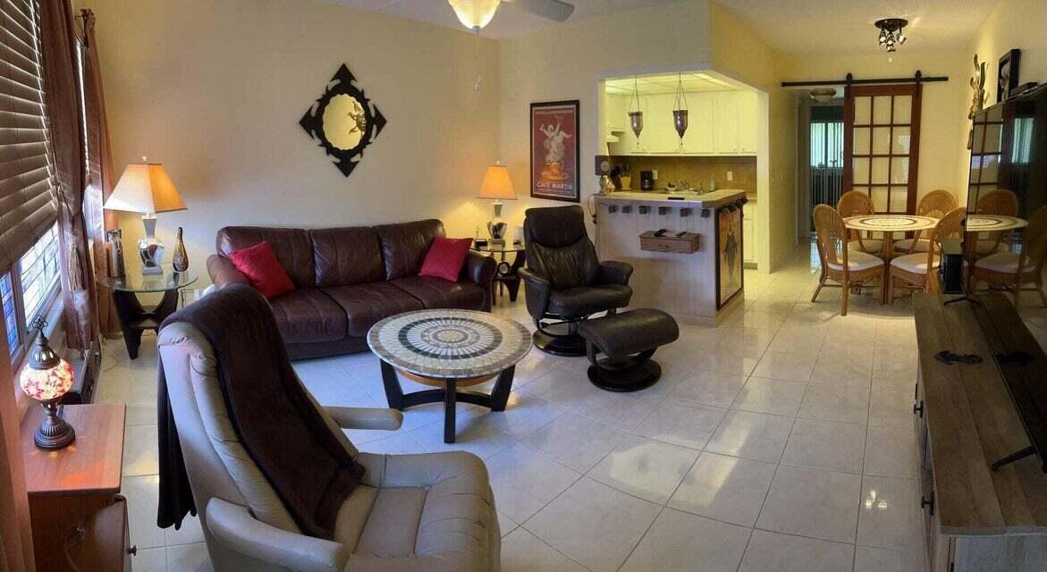 59 Tilford C, Unit 59 Deerfield Beach, FL 33442 - Photo 3 of 39 a living room with furniture