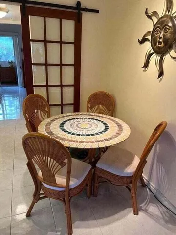 a view of entryway with a window and wooden floor