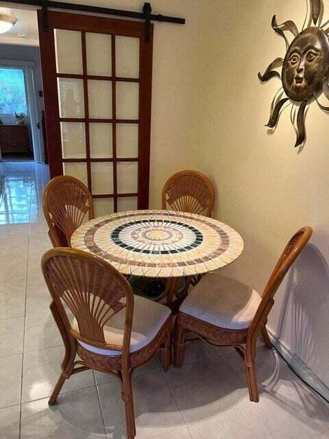 59 Tilford C, Unit 59 Deerfield Beach, FL 33442 - Photo 6 of 39 a dining room with furniture and window
