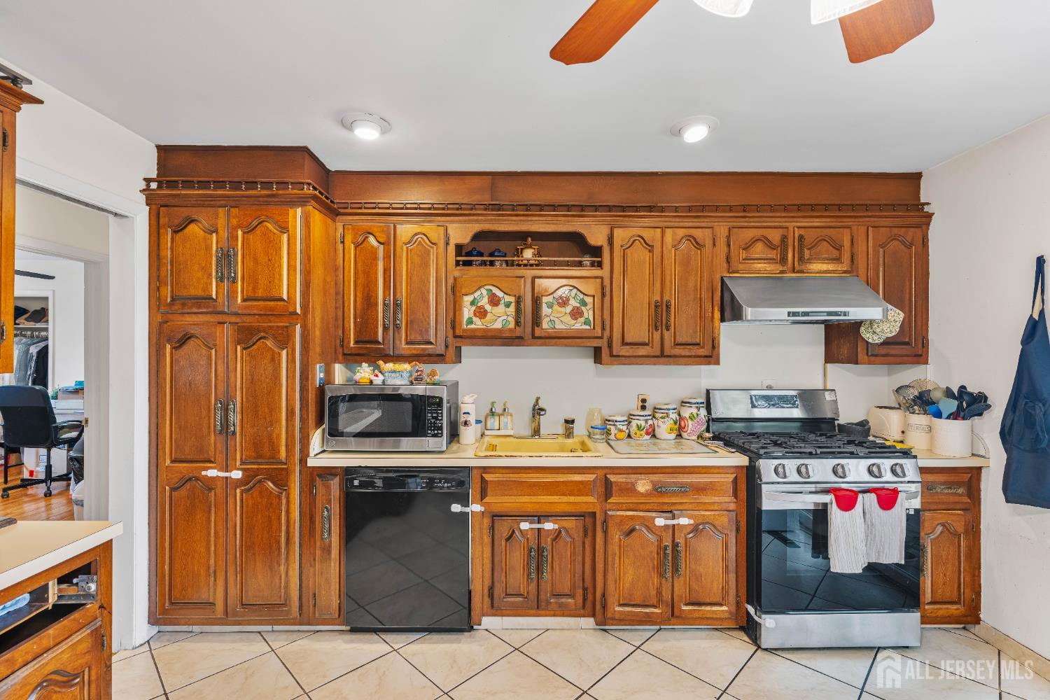 62 Harmon Road Edison, NJ 08837 - Photo 12 of 30 a kitchen with stainless steel appliances granite countertop a stove top oven