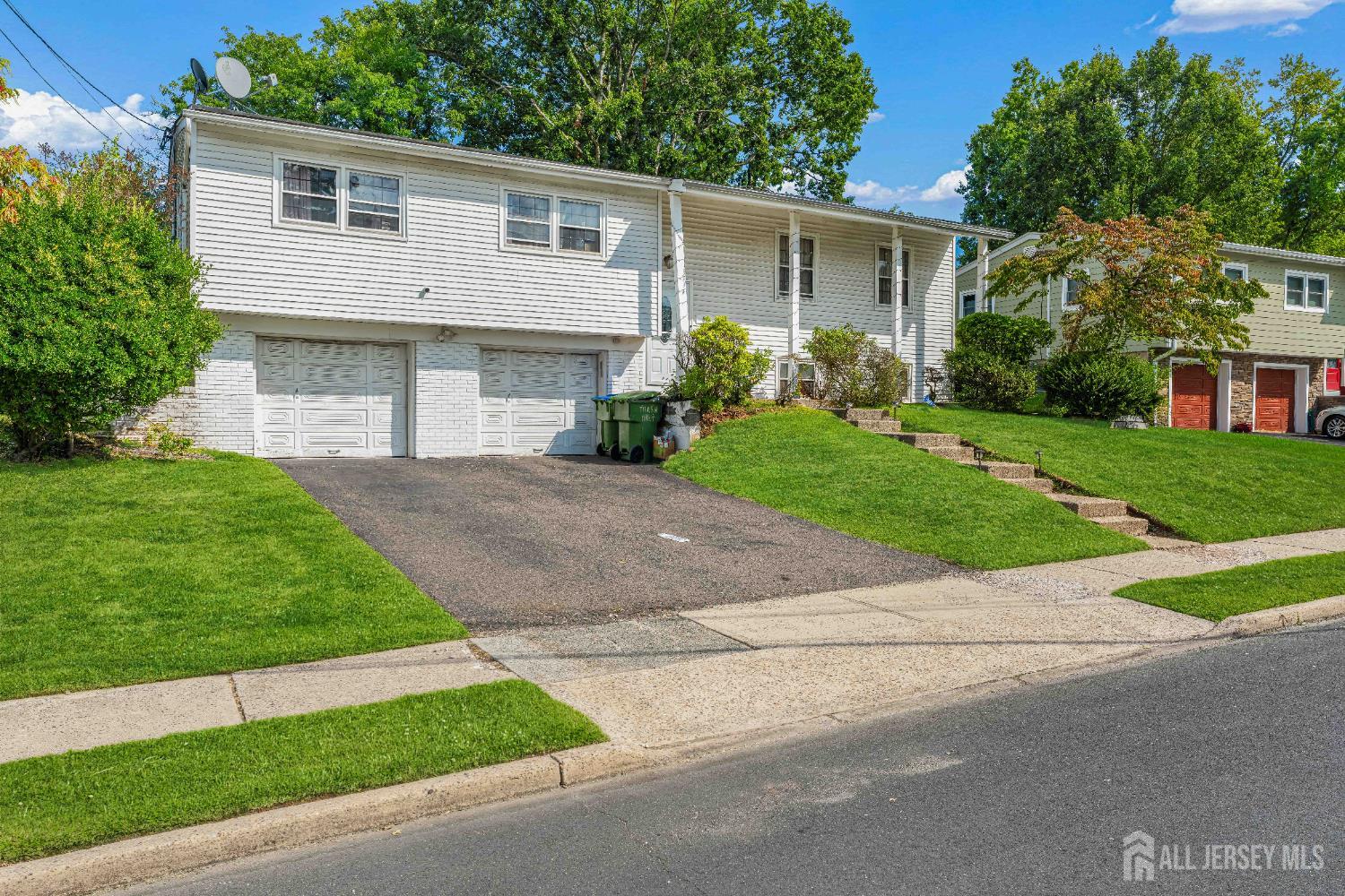 62 Harmon Road Edison, NJ 08837 - Photo 2 of 30 a front view of house with yard and green space