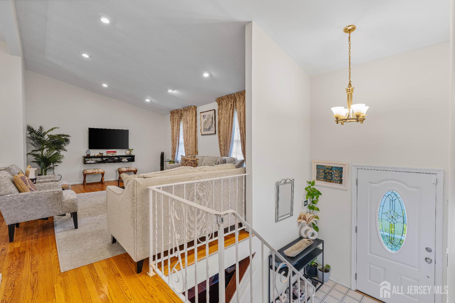 62 Harmon Road Edison, NJ 08837 - Photo 21 of 30 a living room with furniture and flat screen tv