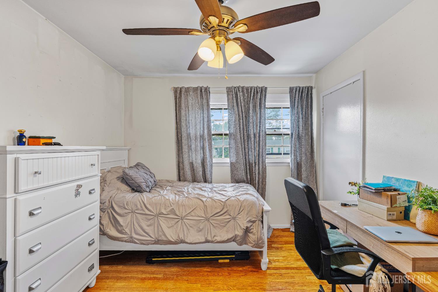 62 Harmon Road Edison, NJ 08837 - Photo 22 of 30 a bedroom with a bed and a chandelier