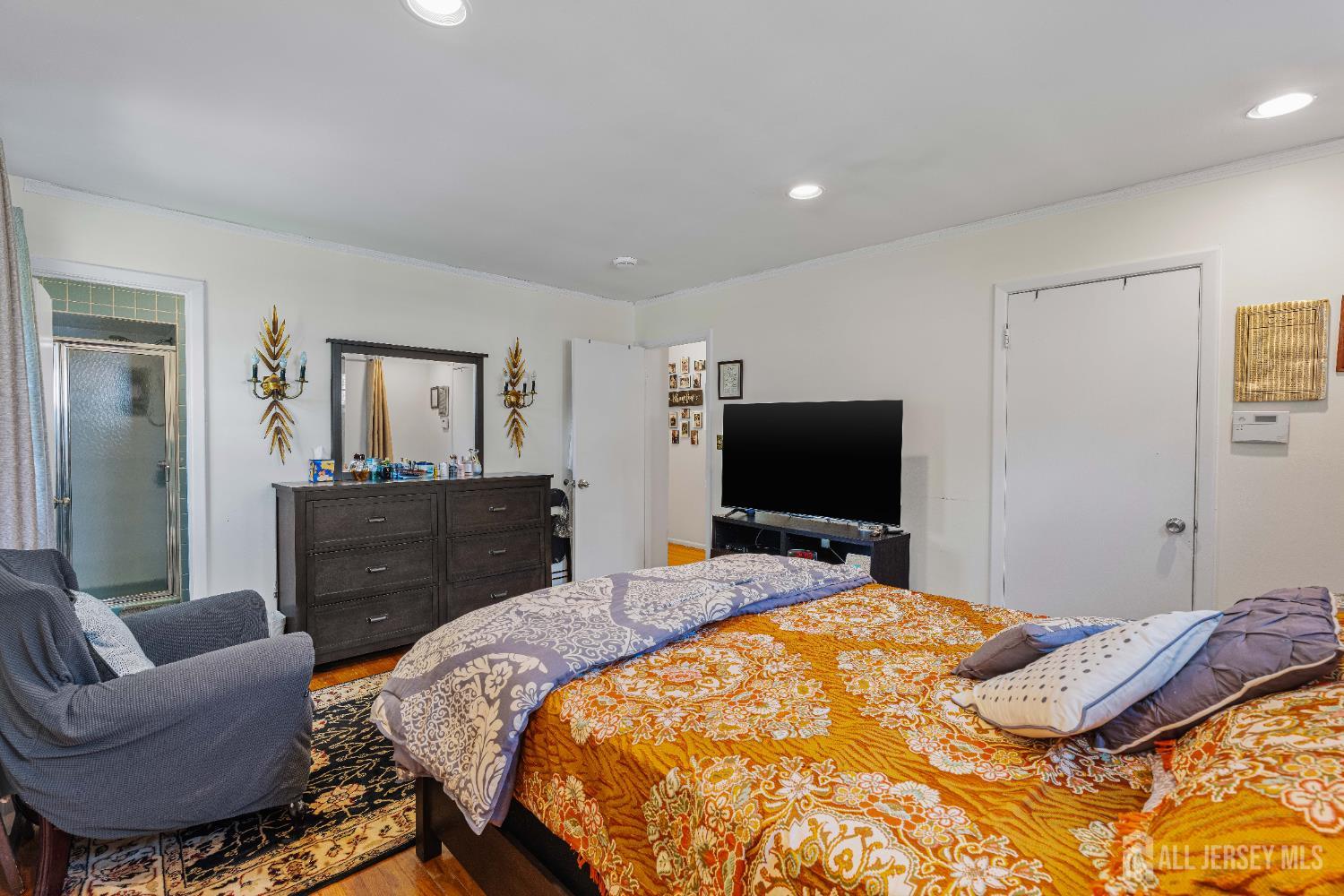 62 Harmon Road Edison, NJ 08837 - Photo 28 of 30 a bedroom with a bed and a flat screen television