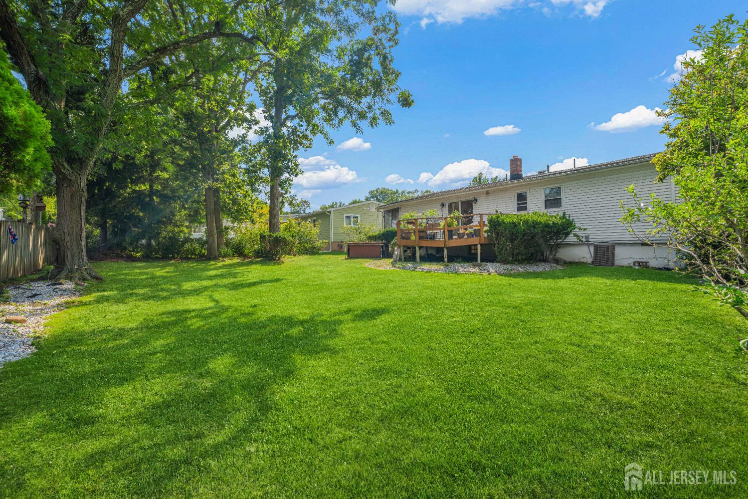 62 Harmon Road Edison, NJ 08837 - Photo 4 of 30 a view of a house with a yard and sitting area