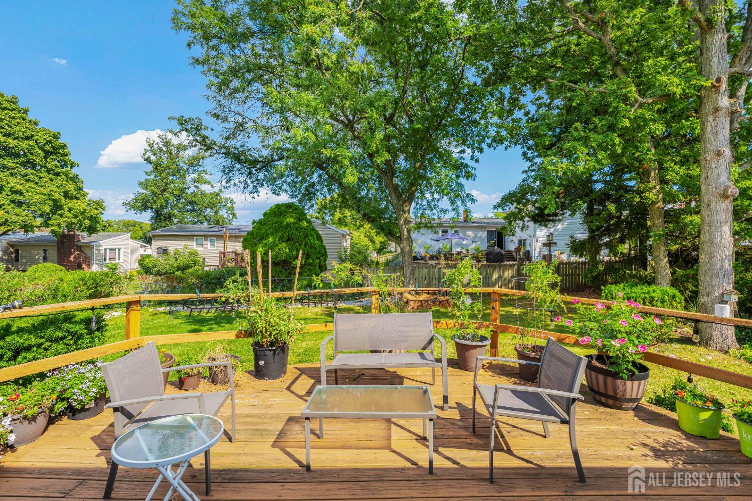 62 Harmon Road Edison, NJ 08837 - Photo 5 of 30 a view of a chairs and table in patio