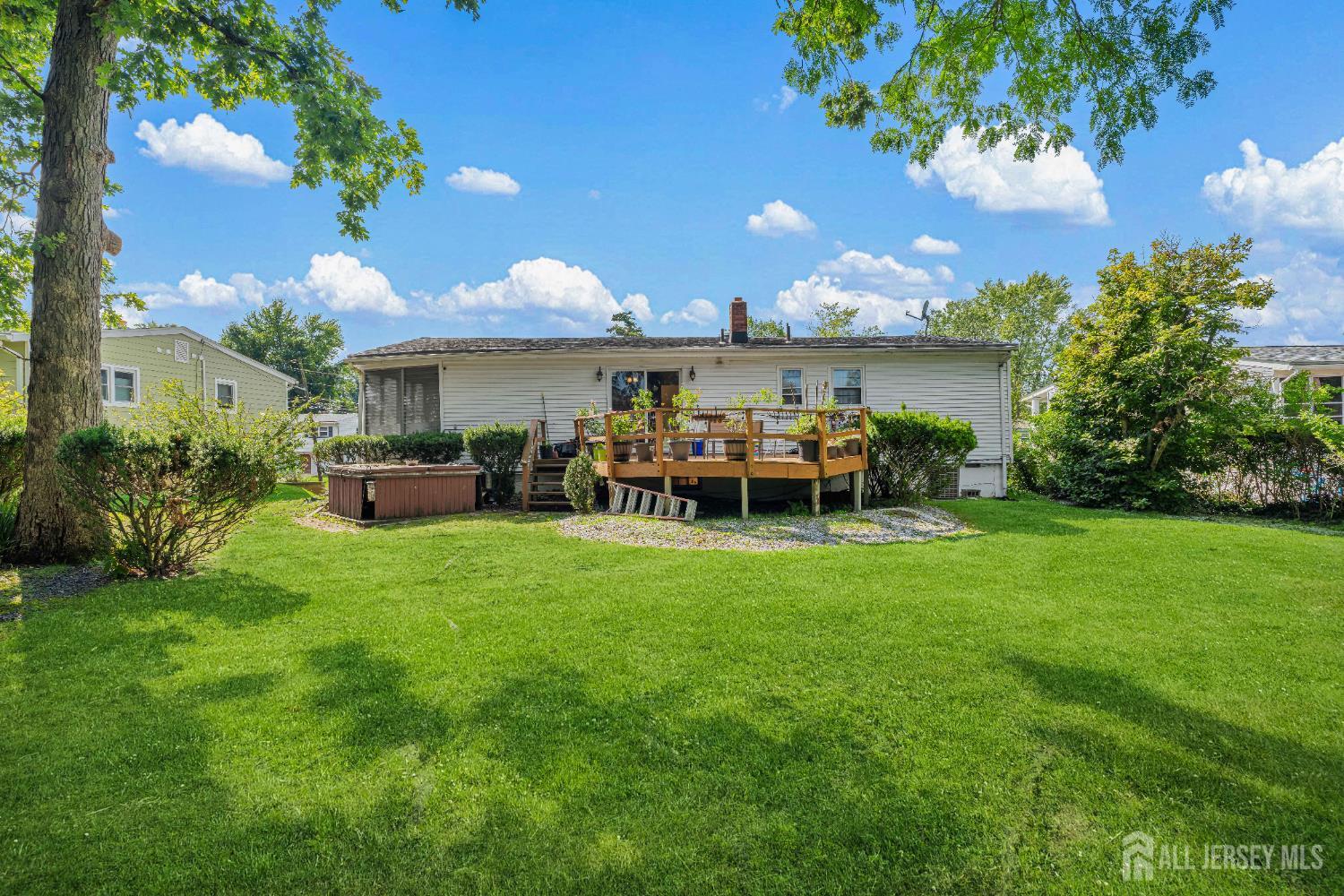 62 Harmon Road Edison, NJ 08837 - Photo 6 of 30 a view of a chair and table in the garden in the backyard
