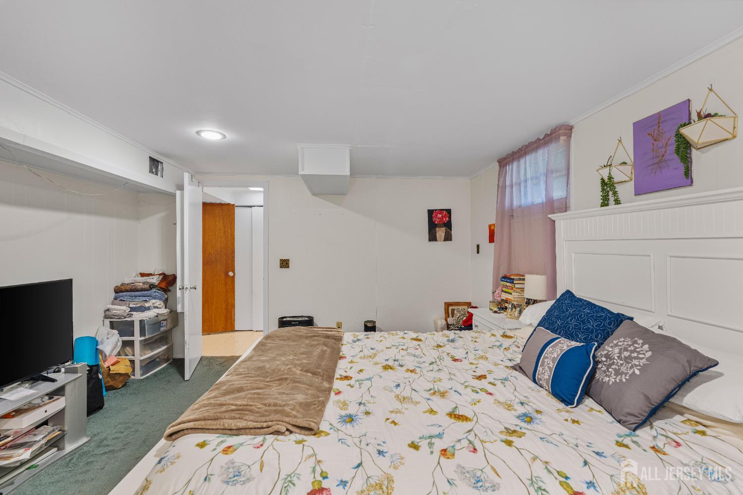 62 Harmon Road Edison, NJ 08837 - Photo 8 of 30 a bedroom with a bed and a couch