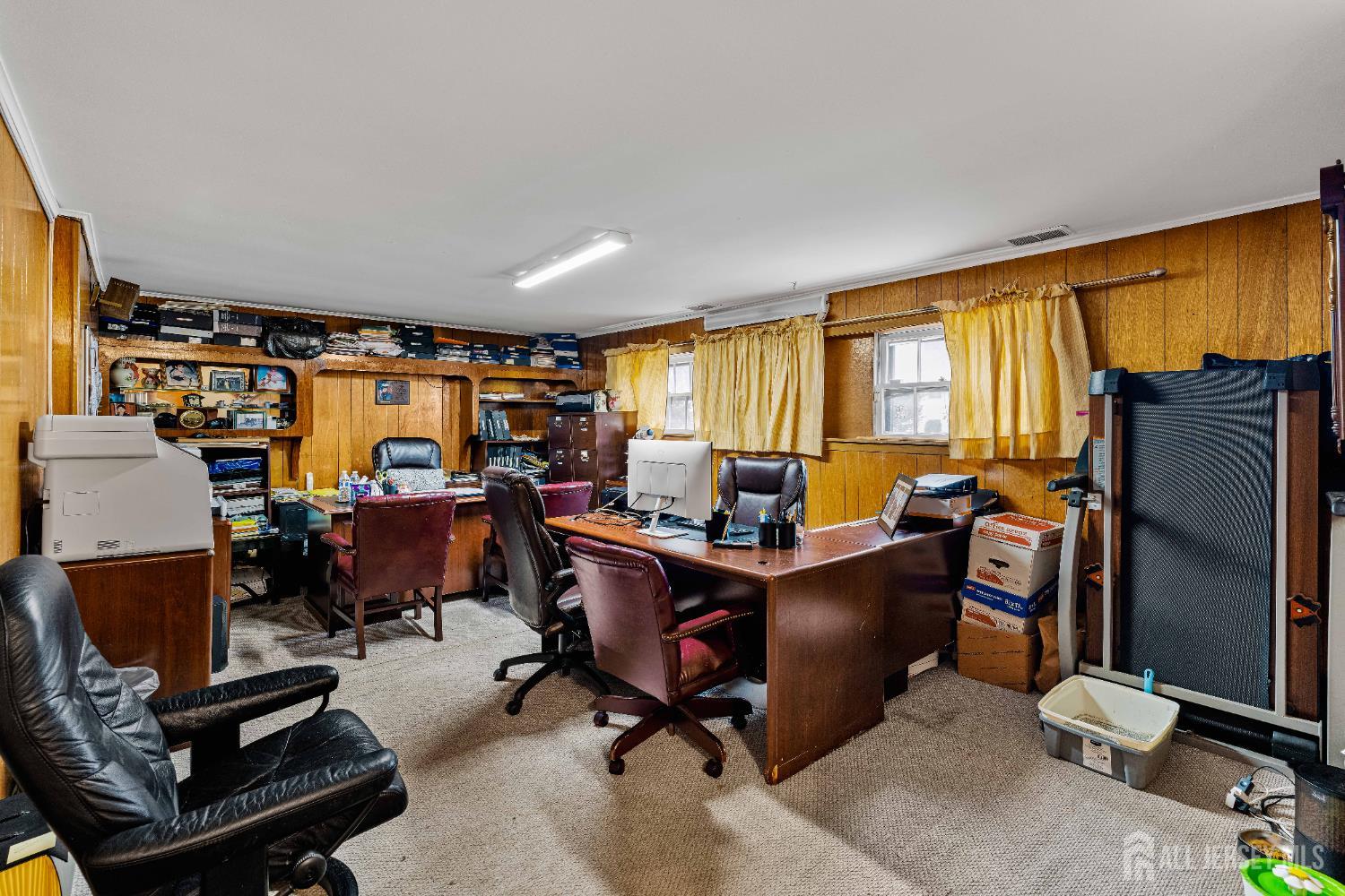 62 Harmon Road Edison, NJ 08837 - Photo 10 of 30 a view of a livingroom with workspace and a window