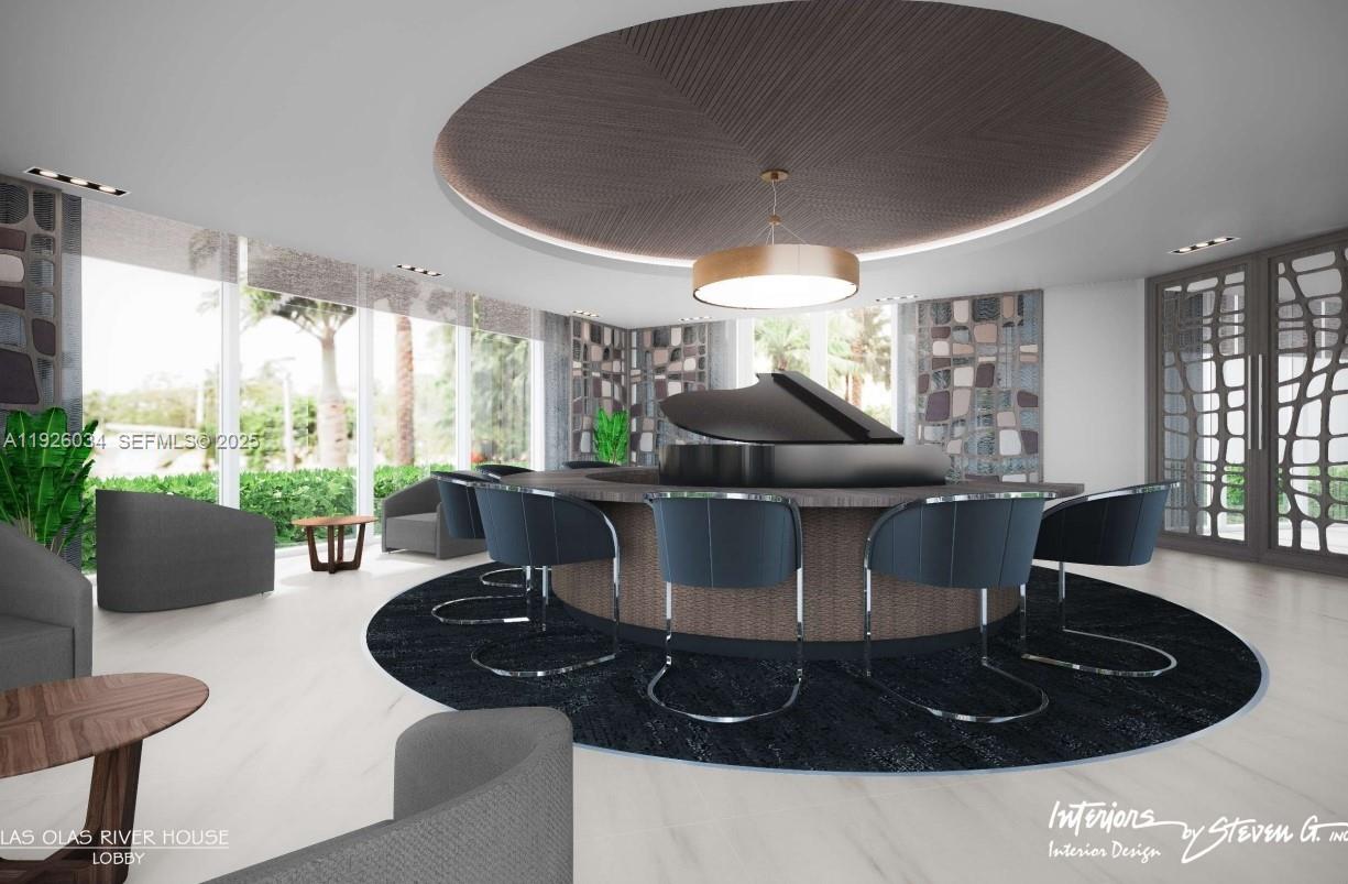 333 Las Olas Way, Unit 2406 Fort Lauderdale, FL 33301 - Photo 14 of 55 a kitchen with a table and chairs