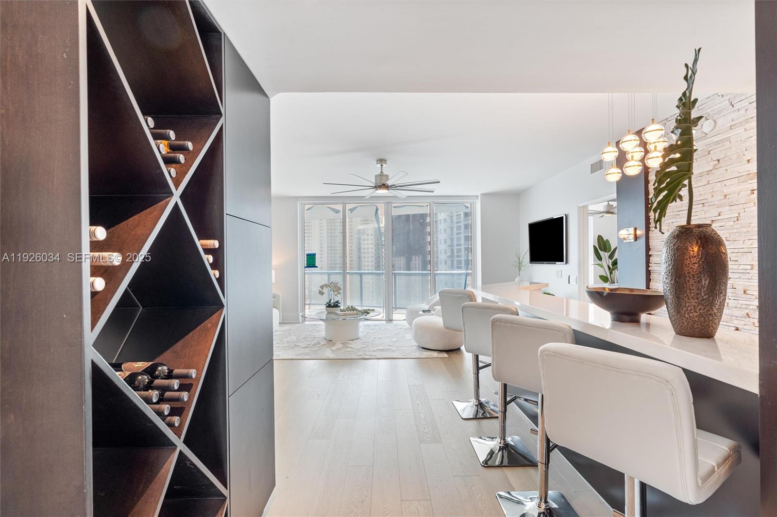 333 Las Olas Way, Unit 2406 Fort Lauderdale, FL 33301 - Photo 17 of 55 a living room with furniture and a flat screen tv