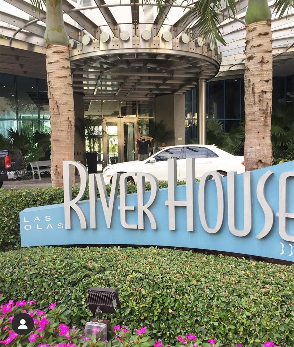 333 Las Olas Way, Unit 2406 Fort Lauderdale, FL 33301 - Photo 2 of 55 a front view of a building with garden