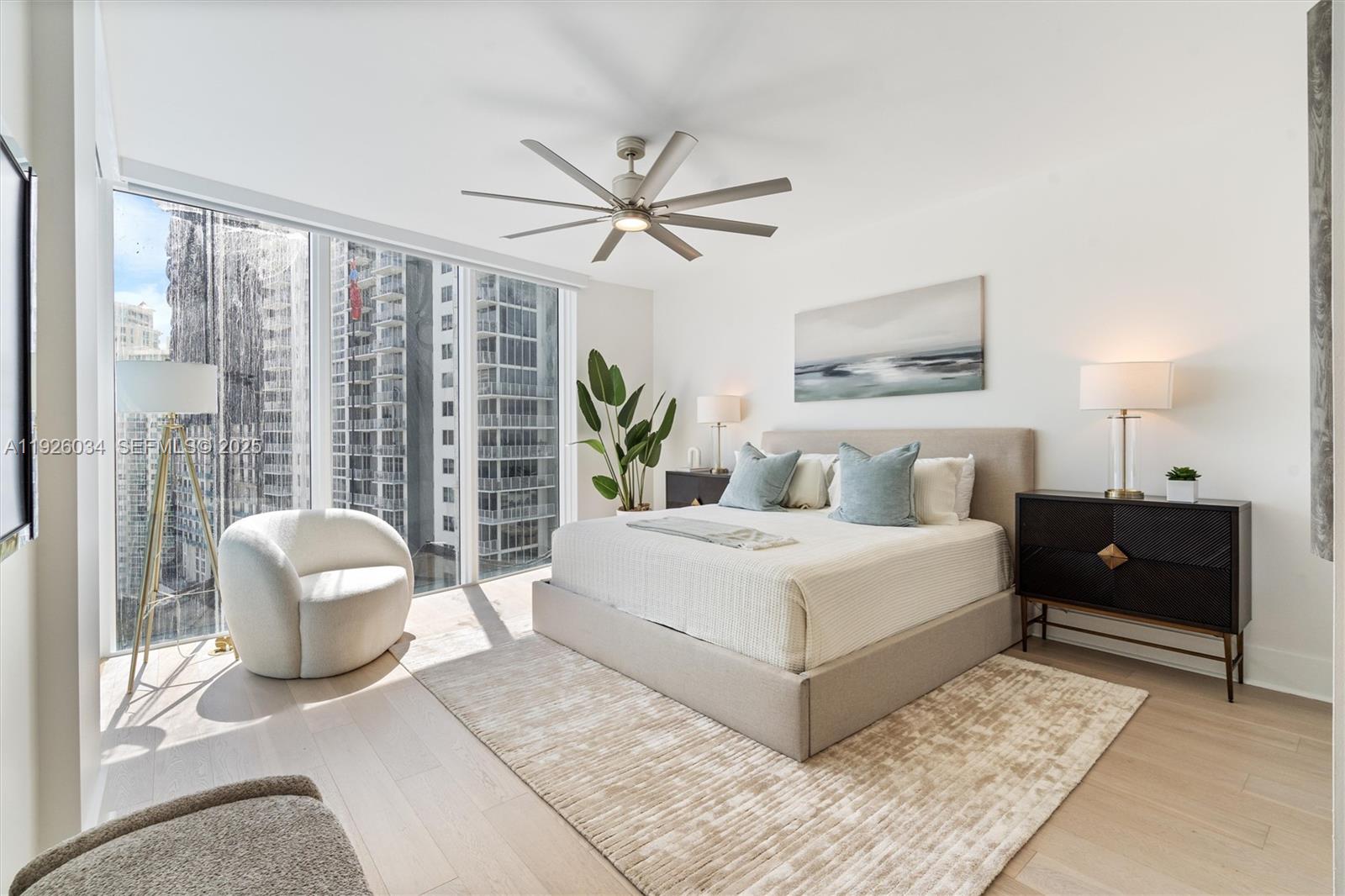 333 Las Olas Way, Unit 2406 Fort Lauderdale, FL 33301 - Photo 35 of 55 a bedroom with a large bed and a large window