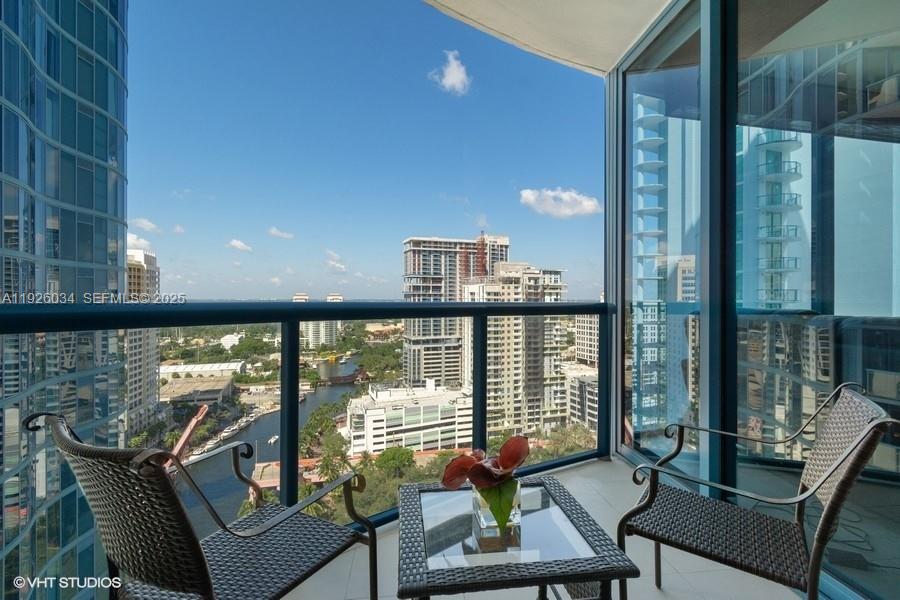 333 Las Olas Way, Unit 2406 Fort Lauderdale, FL 33301 - Photo 41 of 55 a living room with furniture and a floor to ceiling window