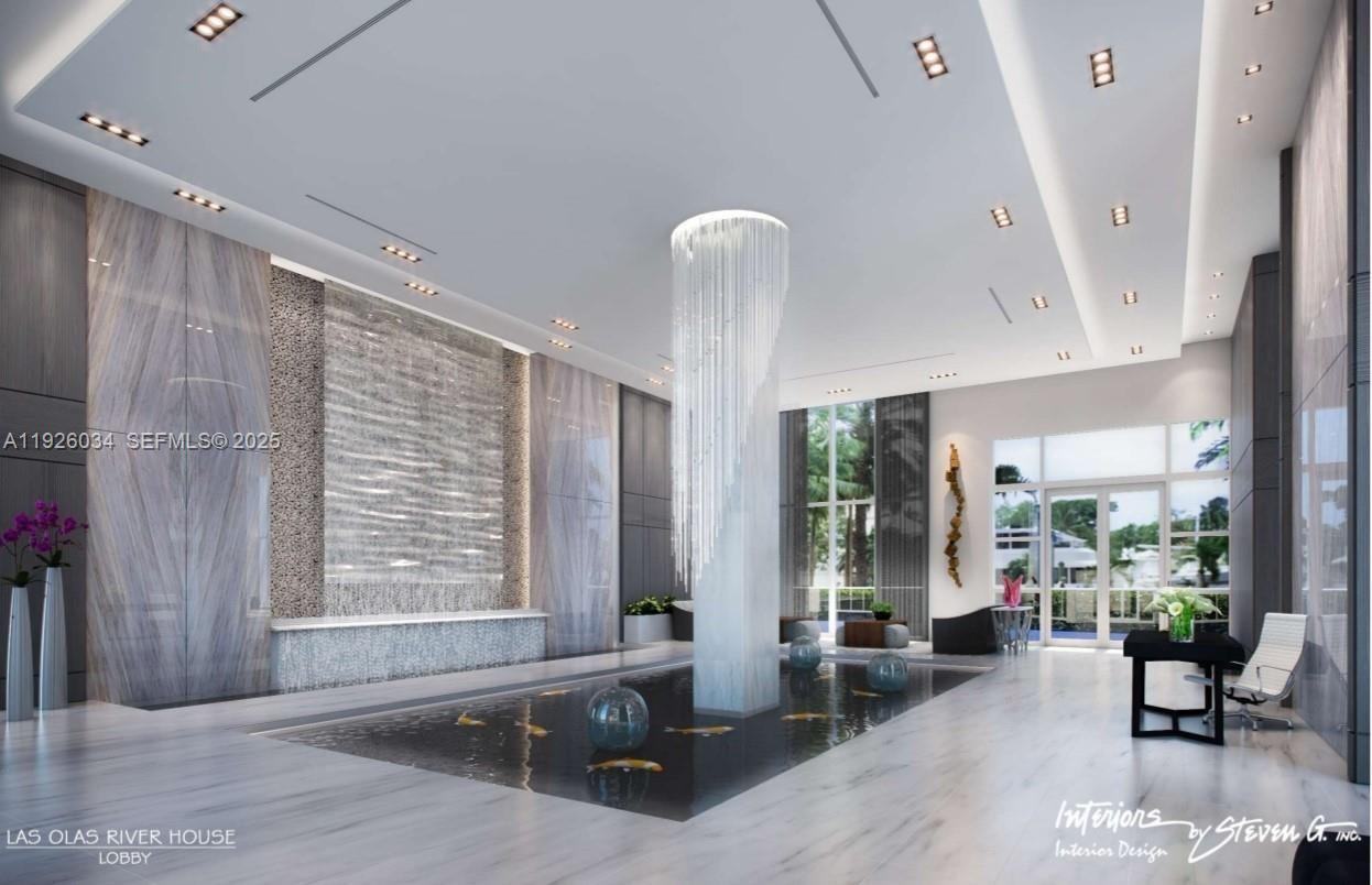 333 Las Olas Way, Unit 2406 Fort Lauderdale, FL 33301 - Photo 7 of 55 a living room with furniture and large windows